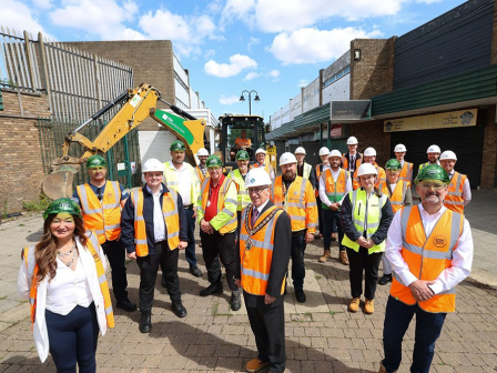 The mayor, council representatives, the RCBC project team, ESH Construction, consultants and architects, stand outside the Eston Precinct wearing high-vis jackets and hard hats