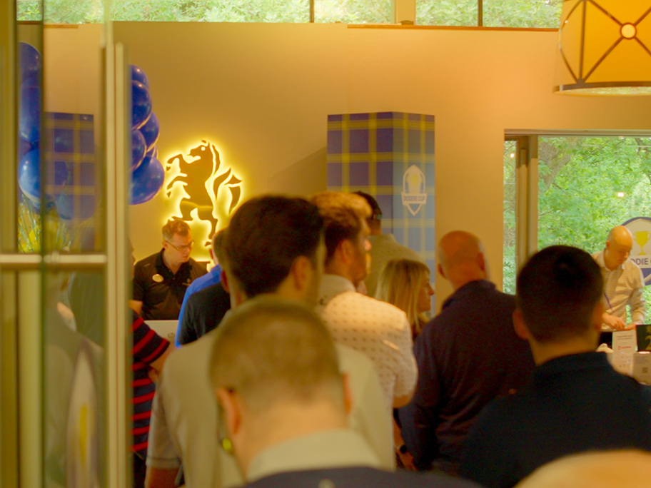 People entering the common room area, for networking and sharing a drink