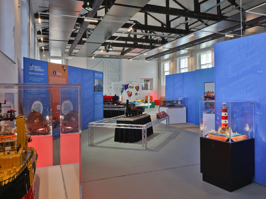 Lego structures in glass cabinets inside a museum
