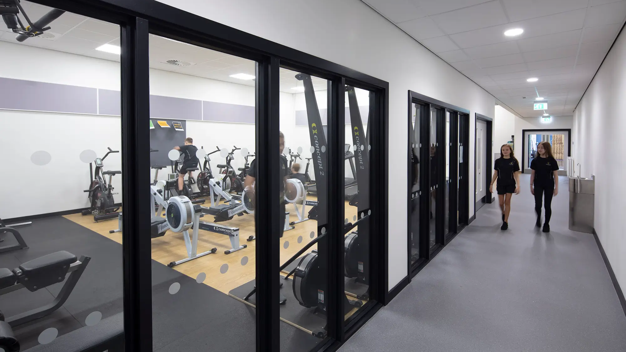 Students walk past the gym at Woodham Academy