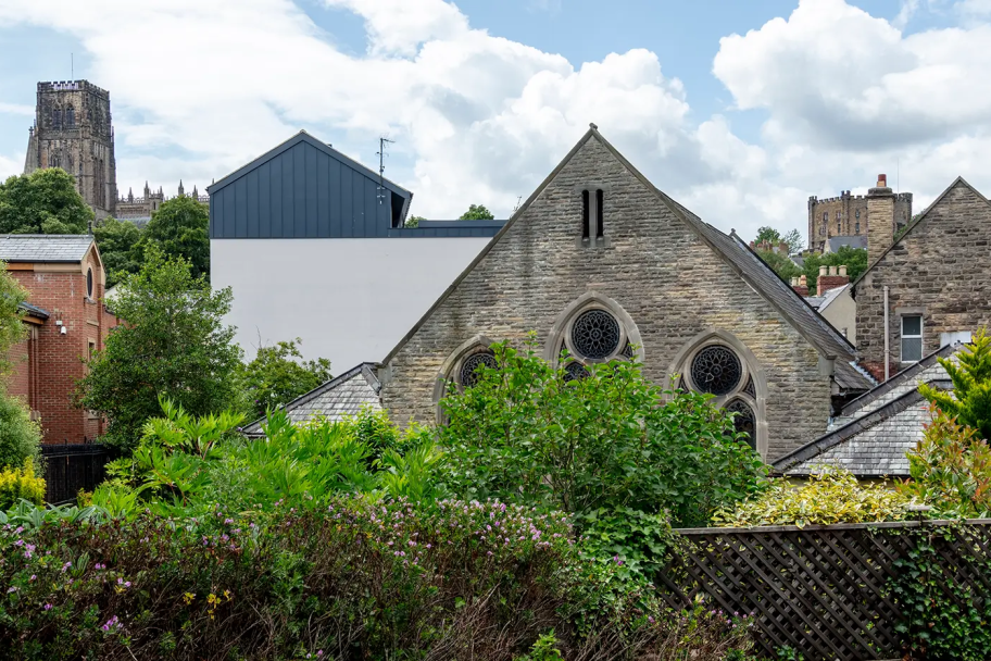 Views of Durham's historic streetscape, with a distant view of the cathedral