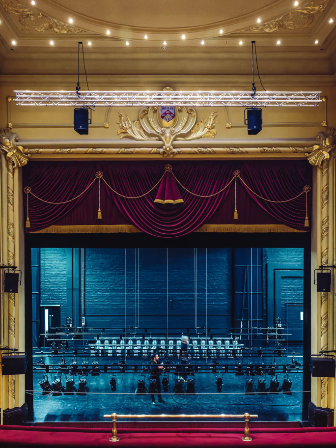 The stage at the Hippodrome with dramatic red velvet curtain and decadent accents