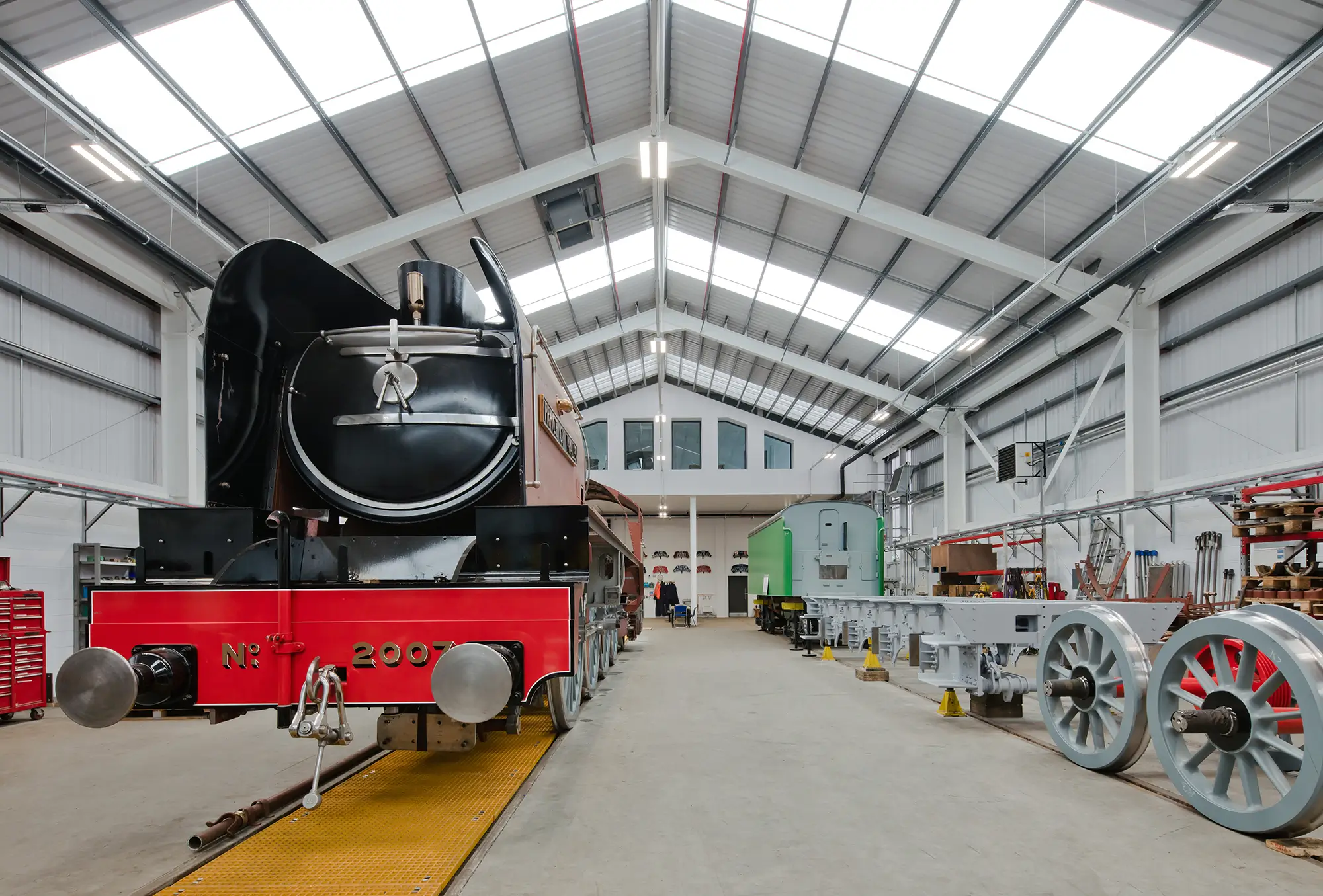 Parts of old steam trains are in a workshop museum