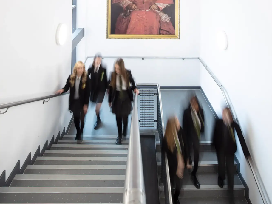 A grey stairwell where students walk to their lessons