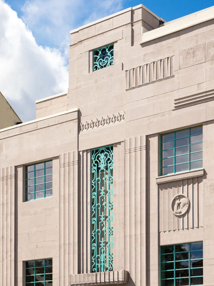 A close up portrait shot of some intricate details on the outside of the building
