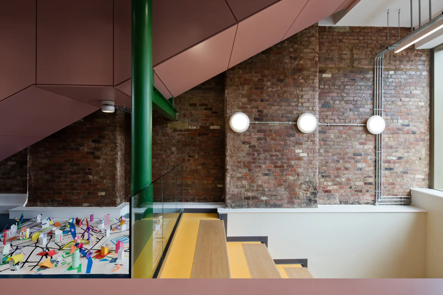 Inside the Farrell Centre, yellow steps leading down and pink and green accents