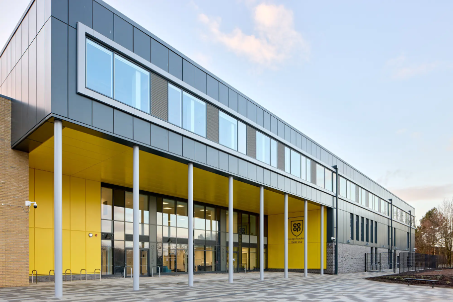 A front view of the Co-op Academy Belle Vue with black and yellow facades
