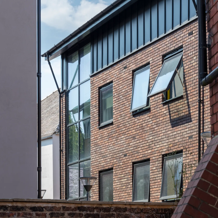 An open window and brick wall at Three Tuns