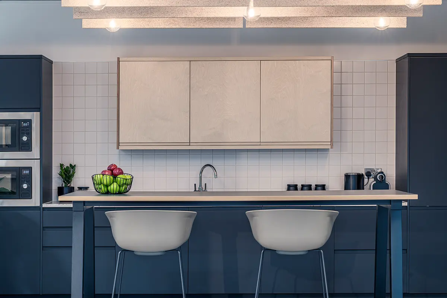 The kitchen space, with two microwaves and lots of cupboard space