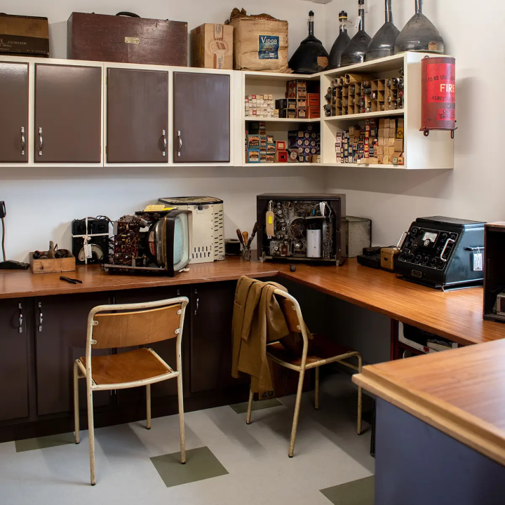 Inside a shop in the 1950s town, with 50s appliances and decor