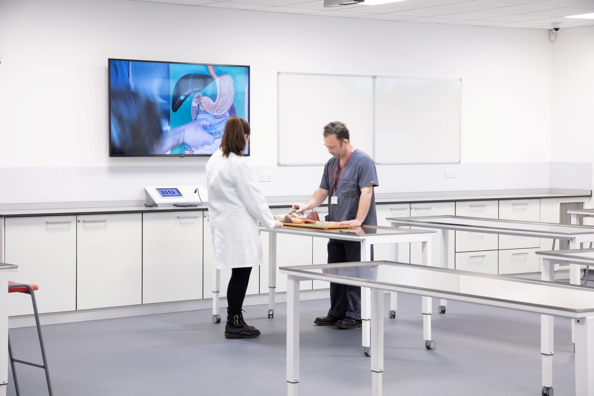 Two medics at a dissection table