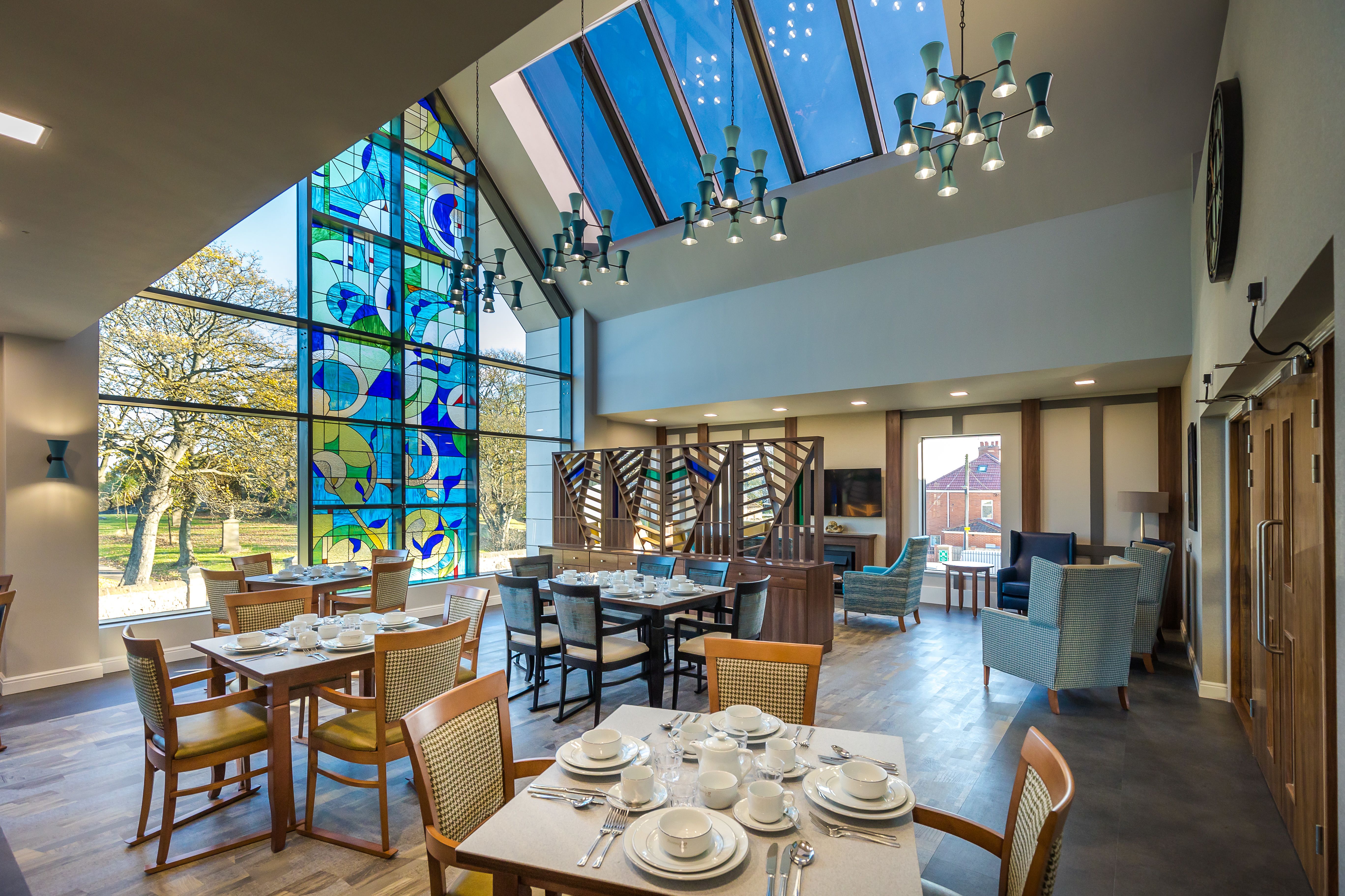 View of Bede House dining room with feature stained glass window