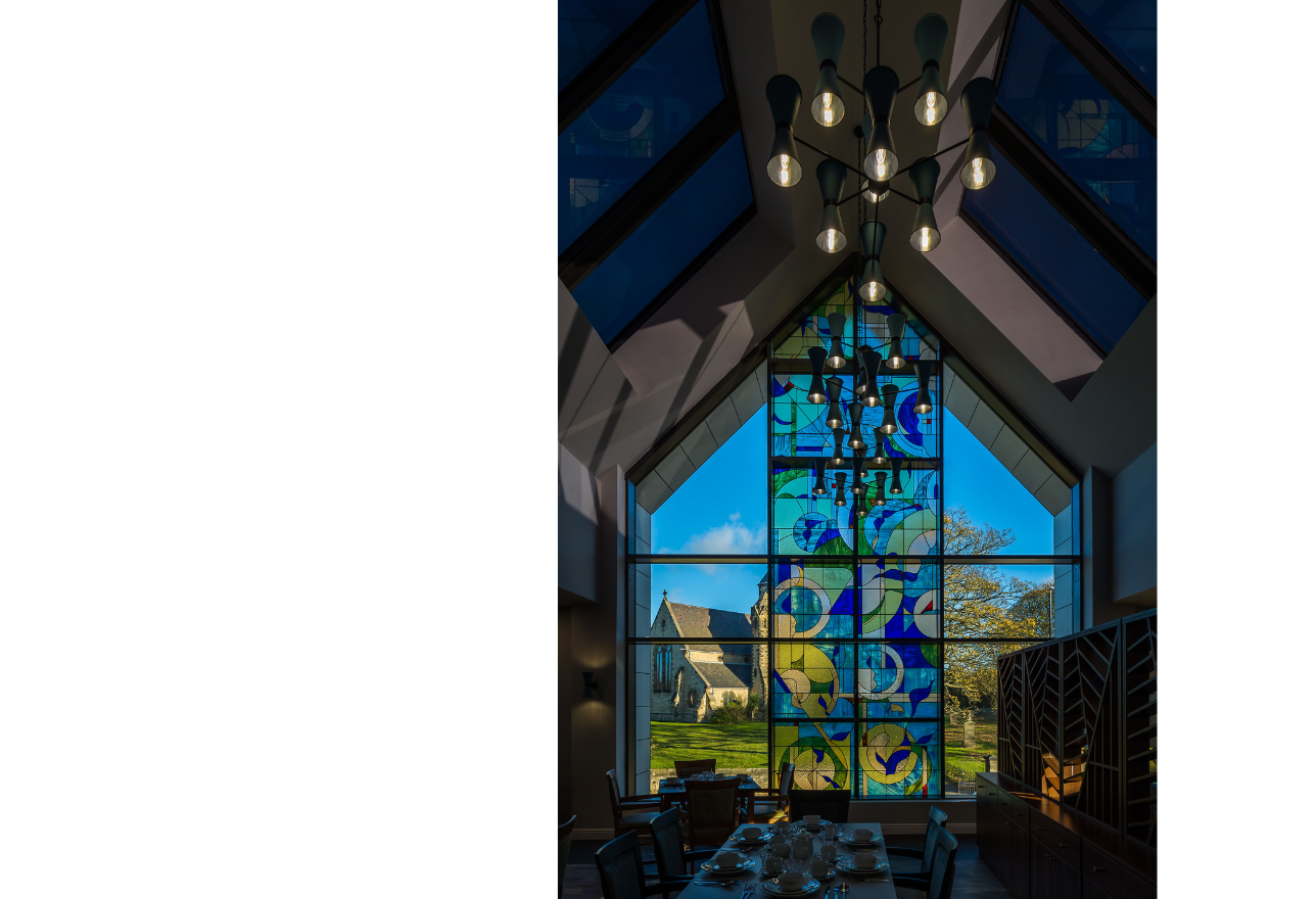 One of Bede House's feature stained glass windows