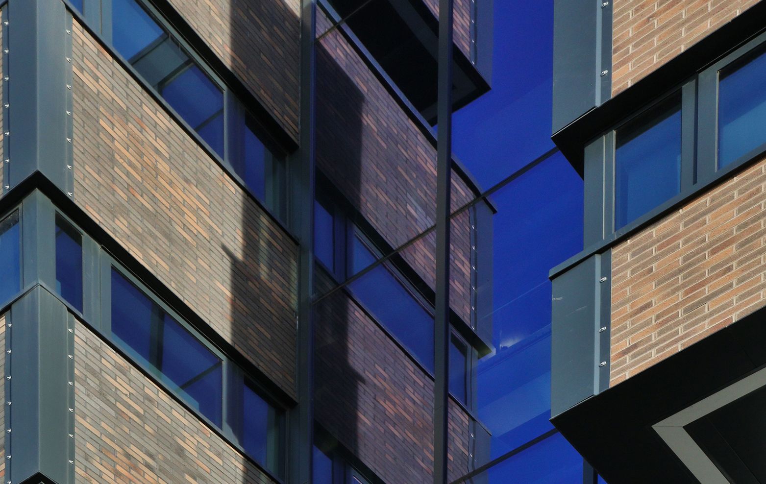 Close up detail of exterior brickwork and windows of Claremont Complex