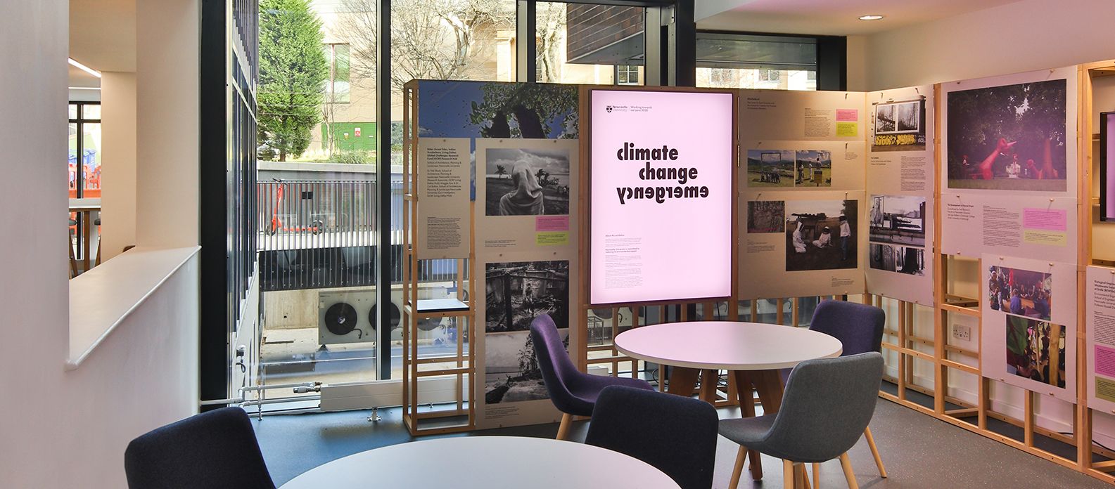 Small seating area featuring Climate Change Emergency display within cafe at Claremont Complex, Newcastle University