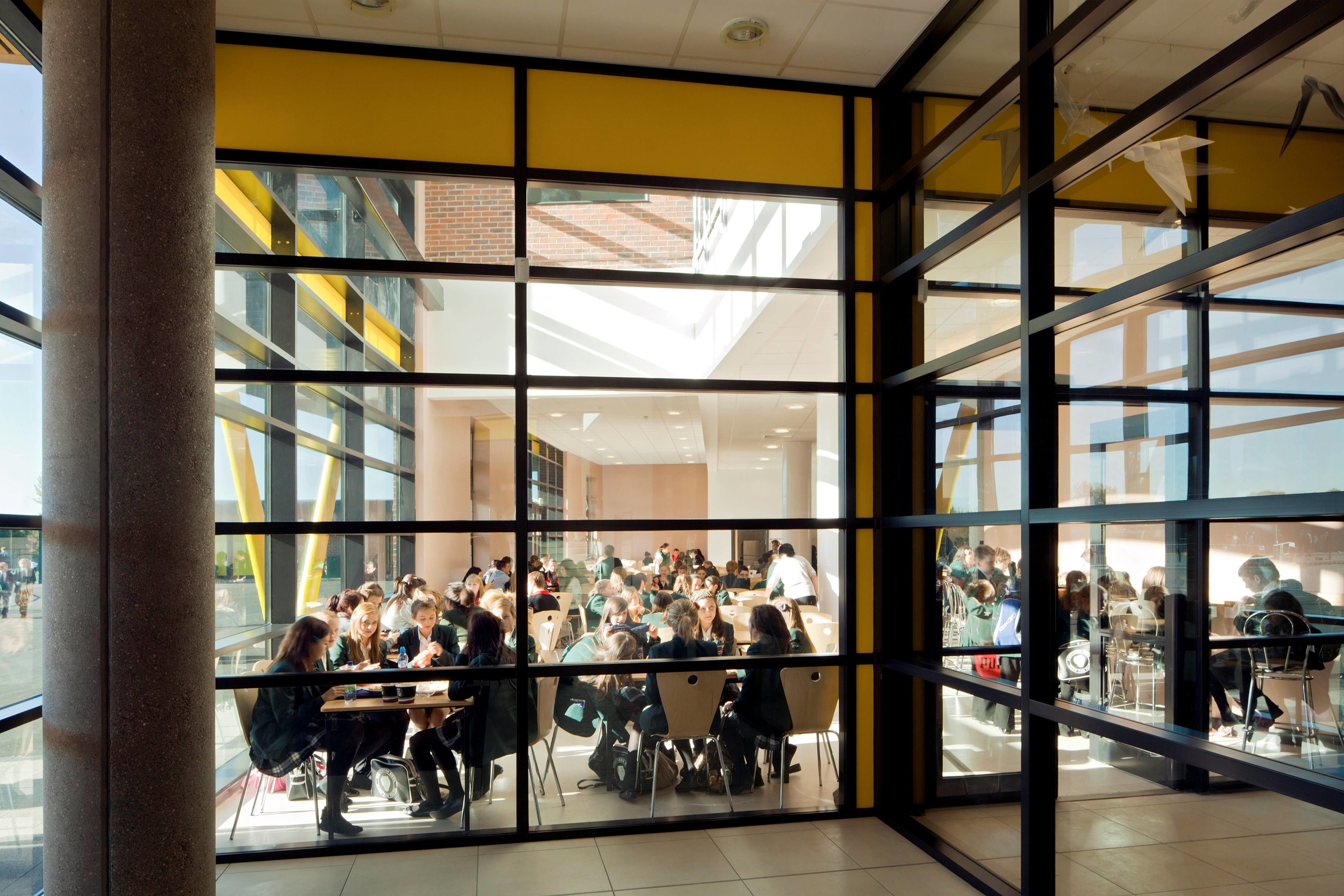 Students seated in the dining room at St Robert of Newminster School during lunchtime