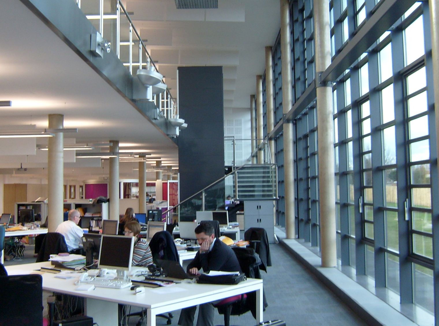 Selby Community Project interior with a man sitting at desk